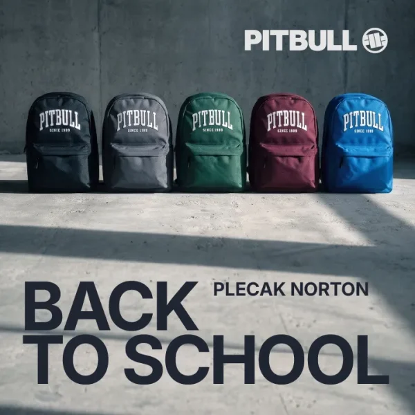 Baner promocyjny Pitbull z kampanii Back to School na tle betonowej ściany i podłogi. W rzędzie stoi pięć plecaków z modelem Norton w różnych kolorach: czarnym, szarym, zielonym, bordowym i niebieskim. Każdy plecak posiada duży biały napis „PITBULL SINCE 1989”. W prawym górnym rogu znajduje się białe logo marki PITBULL. Na dole widnieje duży, ciemny napis „BACK TO SCHOOL” oraz mniejszy „PLECAK NORTON”.
