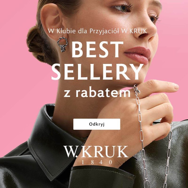 Baner promocyjny marki W.KRUK na różowym tle, przedstawiający zbliżenie na kobietę w czarnej skórzanej kurtce, prezentującą srebrną biżuterię – kolczyk o ozdobnym splocie oraz łańcuszek trzymany w dłoni. Na środku umieszczono biały napis „W Klubie dla Przyjaciół W.KRUK BESTSELLERY z rabatem”, pod nim biały przycisk „Odkryj”, a na dole duże białe logo „W.KRUK 1840”.