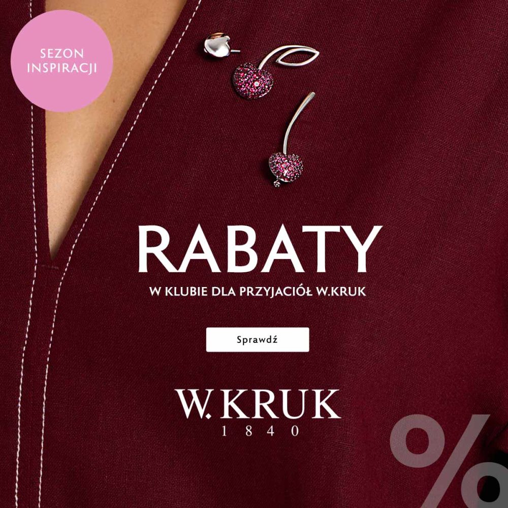 Baner promocyjny marki W.KRUK w głębokim, bordowym odcieniu, przedstawiający fragment eleganckiej stylizacji z przypiętymi broszkami w kształcie wisienek wysadzanych różowymi kamieniami. W lewym górnym rogu umieszczono różowe kółko z napisem „SEZON INSPIRACJI”, na środku duże białe nagłówki „RABATY W KLUBIE DLA PRZYJACIÓŁ W.KRUK” oraz przycisk „Sprawdź”, a niżej logo „W.KRUK 1840” i fragment dużego symbolu „%” w prawym dolnym rogu.