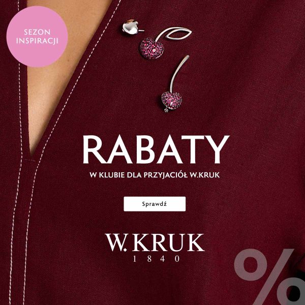 Baner promocyjny marki W.KRUK w głębokim, bordowym odcieniu, przedstawiający fragment eleganckiej stylizacji z przypiętymi broszkami w kształcie wisienek wysadzanych różowymi kamieniami. W lewym górnym rogu umieszczono różowe kółko z napisem „SEZON INSPIRACJI”, na środku duże białe nagłówki „RABATY W KLUBIE DLA PRZYJACIÓŁ W.KRUK” oraz przycisk „Sprawdź”, a niżej logo „W.KRUK 1840” i fragment dużego symbolu „%” w prawym dolnym rogu.