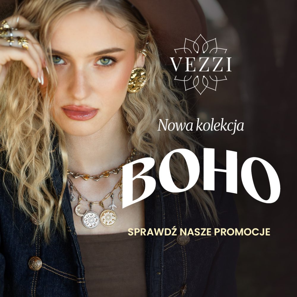 Baner wizerunkowo-promocyjny marki VEZZI przedstawiający blondynkę w kapeluszu i dżinsowej kurtce, prezentującą złotą biżuterię: efektowne kolczyki, liczne pierścionki oraz warstwowe naszyjniki z zawieszkami. W prawej części obrazu umieszczono białe logo „VEZZI”, napis „Nowa kolekcja”, duży nagłówek „BOHO” oraz wezwanie do działania „SPRAWDŹ NASZE PROMOCJE”.
